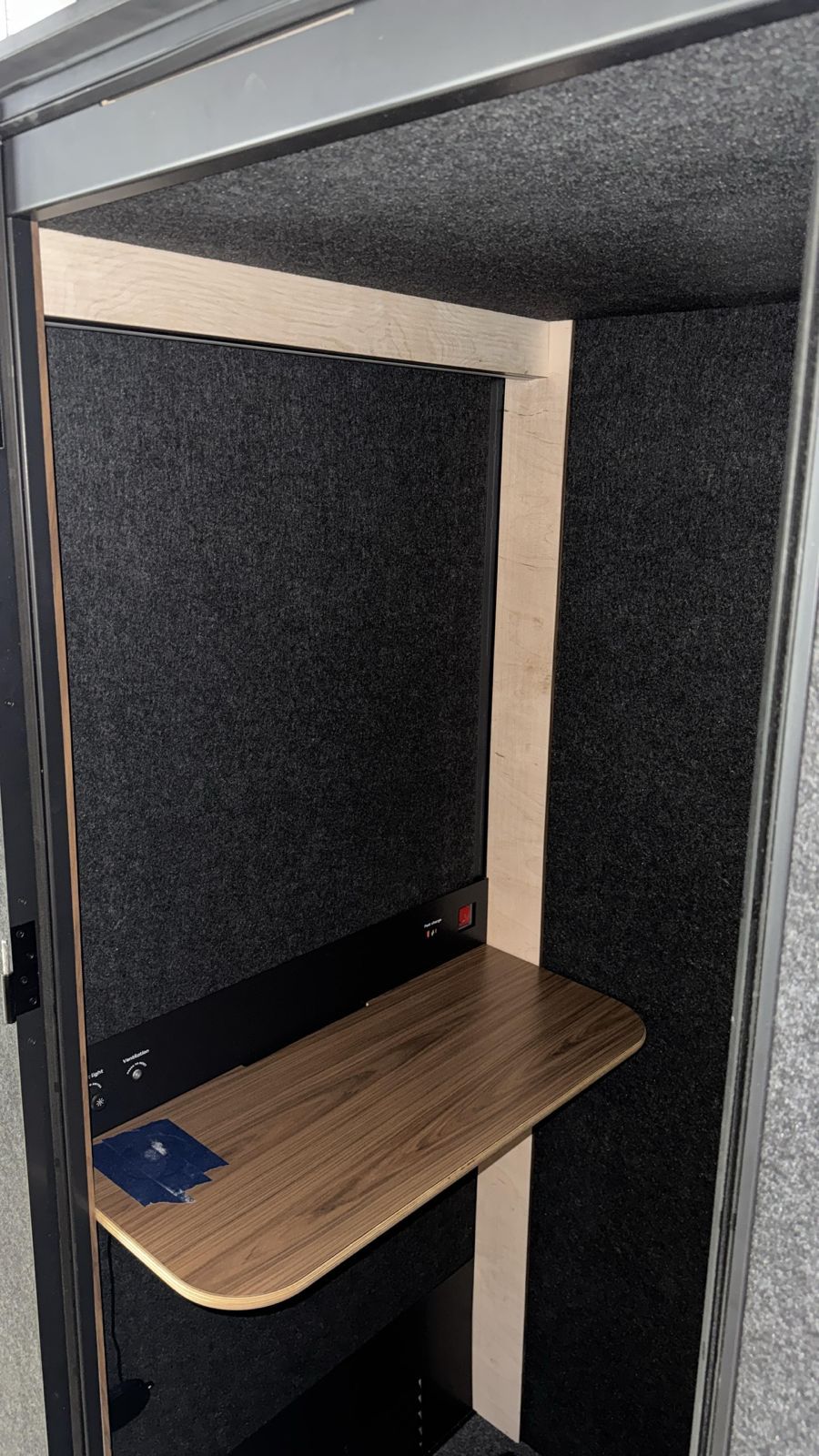 Office phone booth installed with desk and lighting
